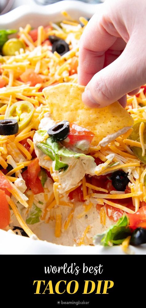 The only Taco Dip you’ll ever need—a thick layer of taco seasoned cream cheese & sour cream topped with crisp lettuce, diced tomatoes, olives, spicy jalapeños and cheddar cheese. Like the best taco in dip form! | Recipe at BeamingBaker.com Taco Dip Recipe With Cream Cheese, Taco Dip With Cream Cheese And Salsa, 3 Layer Taco Dip, Football Taco Dip, Touch Down Taco Dip, The Best Taco Dip, Layered Taco Dip Recipe, Mexican Dip Cold, Seven Layer Taco Dip Recipes