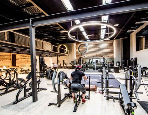 The timber plank finish to walls really compliments the black metal work and industrial ceiling features in this gym fit-out. Factory refurbishment at it's best. | Architecture | style | loft | light | lighting | rustic | commercial | design | timber | black | ceiling | fitness | wood | inspiration | contemporary | workout | spaces | beam | column | Warehouse Gym Design Industrial Style, Personal Gym Design, Clubs Interior Design, Industrial Gym Design, Gym Ideas Design Commercial, Warehouse Gym Design, Commercial Design Retail, Industrial Gym, Sport Facility