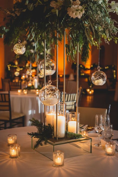 Hanging Lights Centerpiece, Branch Centerpieces Wedding Winter, Glass Orbs Wedding, Nature Centerpieces Wedding, Romantic Whimsical Wedding Centerpieces, Indoor Nature Wedding Decor, Hanging Orbs Wedding, Green Table Centerpieces Wedding, Mystical Wedding Centerpieces