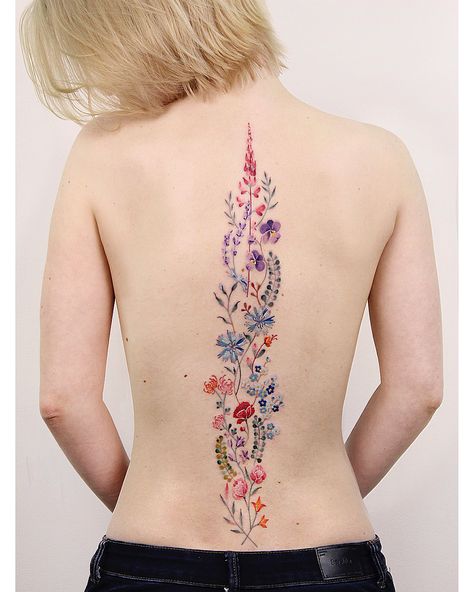 Image may contain: one or more people Spine Tattoos Colorful, Color Spine Tattoo, Colorful Spine Tattoo, Floral Spine Tattoos For Women, Flower Spine Tattoo, Backpiece Tattoo, Flower Spine Tattoos, Spine Tattoos For Women, Spine Tattoo