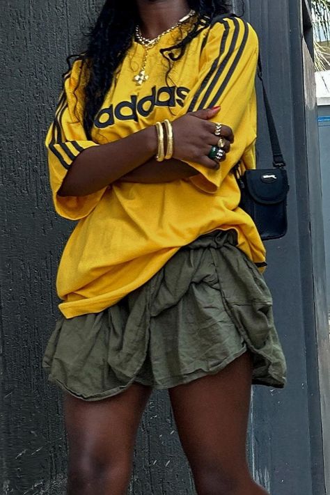 Effortlessly sporty and chic: pair your favorite Adidas yellow jersey with a vibrant green skirt for a casual yet stylish look. Complete the outfit with gold jewelry to elevate your sporty style. Perfect for any occasion! 🌟 #JerseyAndSkirtOutfit #SportyFashion #CasualChic #AdidasFashion #StreetStyle #WomensFashion #jerseyoutfitblackwomen Trendy Bottoms, Look Festival, Looks Black, Sporty Outfits, May 22, Girly Outfits, Fashion Killa, Skirt Outfits, Cute Casual Outfits