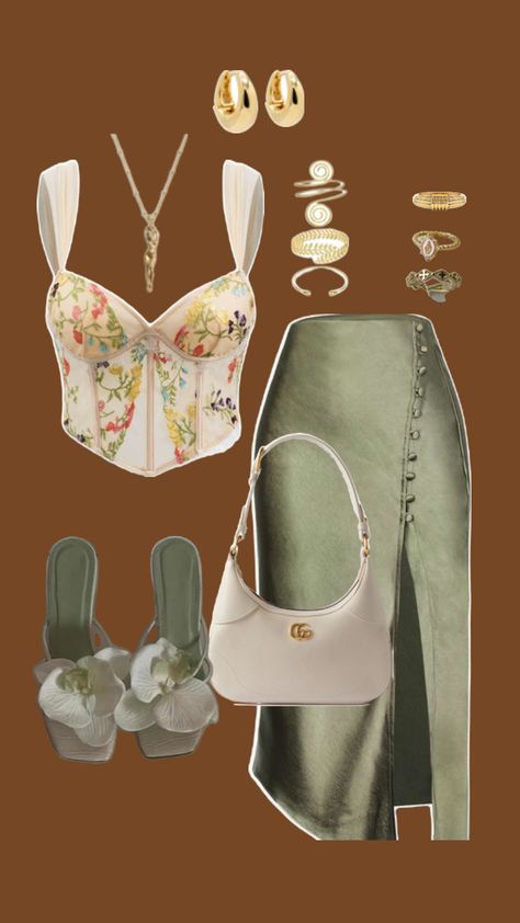 Embrace the essence of summer sophistication with this stunning look. The floral corset top paired with an elegant olive-green wrap skirt is the perfect balance of feminine charm and modern elegance. Elevate the ensemble with delicate gold accessories, a sleek ivory handbag, and floral-embellished heels that add a touch of whimsy. Whether it’s a sunset dinner or a night out, this outfit will have you turning heads. 💐✨ Olive Green Skirt Outfit, Corset Top And Skirt Outfit, Green Skirt Outfits, Corset Top Outfit, Floral Corset Top, Olive Green Skirt, Sunset Dinner, Summer Date Night, Corset Outfit