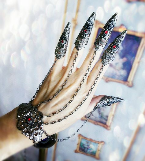 Gothic Claw Rings Nail armor Bracelet Set Made in your Custom Color choice! by ravenevejewelry on Etsy https://www.etsy.com/listing/453296976/gothic-claw-rings-nail-armor-bracelet Armor Jewelry, Claw Rings, Nail Armor, Gothic Engagement Ring, Claw Ring, Jewel Colors, Nail Ring, Hand Jewelry, Fantasy Jewelry