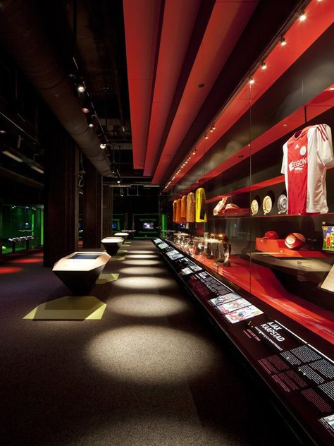 Ajax Experience Museum by Sid Lee Architecture & gsmprjct° visual merchandising store design exhibit design Afc Ajax, Museum Lighting, Museum Interior, Museum Exhibition Design, Stadium Design, Desain Editorial, Museum Displays, Retail Store Design, Exhibition Booth