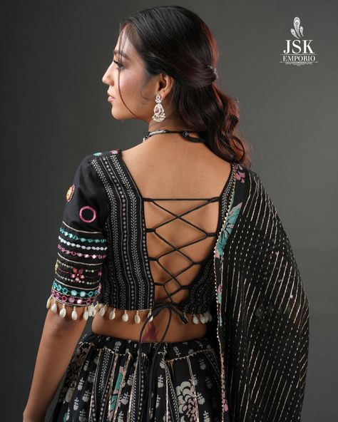 It's all in the details! From the laced back, to the beautifully embellished blouse sleeves, flowing dupatta, and playful latkans — this black Chaniya Choli from our Navratri Collection 2024 is a work of art in every stitch.

#JSKEmporio #FestiveWear #festivecollection2024 #festivecollection #FestiveFashion #Newcollection #Traditional #navratricollection #navratrichaniyacholi #chaniyacholicollection #TrendingDesigns #blackchaniyacholi #navratricollection2024 #blouse #chaniyadesign #GarbaLook Black Chaniya Choli Designs, Navratri Choli Designs, Navratri Blouse Designs, Chaniya Choli Designs Navratri, Black Chaniya Choli, Navratri Blouse, Designer Choli, Chaniya Choli Designs, Navratri Lehenga