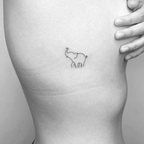 Minimalistic style elephant tattoo done in fine line. Joshua Tattoo, Small Elephant Tattoo, Simple Elephant Tattoo, Tiny Elephant Tattoo, International Tattoo, Africa Tattoos, Elephant Tattoo Design, Handpoke Tattoo, Strength Tattoo