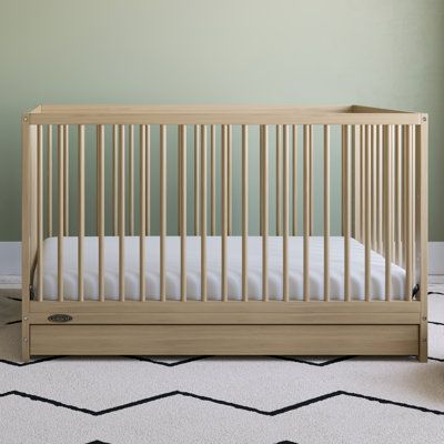 Bring your dream nursery to life with the Graco Teddi 5-in-1 Convertible Crib with Drawer. With its clean, modern, and timeless design, the Teddi is the perfect addition to any nursery, and easy to match with any style. The Teddi is crafted from pine wood, poplar dowels, and wood composites and includes Euro drawer glides, its applied finish has been tested to meet or exceed the applicable ASTM and CPSIA safety standards. The Teddi Greenguard Gold Certified Certified products are screened for mo Crib With Storage, Dream Nursery, Baby Crib Mattress, Childrens Bedroom Furniture, Best Crib, Drawer Glides, Big Beds, Toddler Mattress, Dream Nurseries