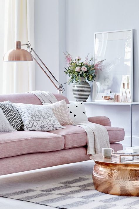 Layer soft rose pink with grey, choose a classic sofa as the room’s centrepiece, then introduce pattern with decorative cushions and a rug. Contrast the soft colours with a statement floor lamp and coffee table. For more living room ideas visit housebeautiful.co.uk Feminine Living Room, Smart Tiles, Deco Rose, Interior Vintage, Pink Sofa, Versace Home, Hus Inspiration, Design Living, A Living Room