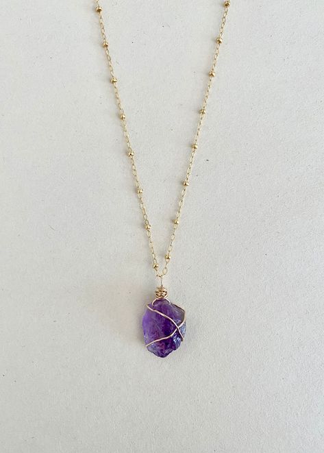 There is raw beauty, serenity and calm with Amethyst, it's truly something magical. Connect with your inner peace by wearing Amethyst. DETAILS Raw Amethyst stone measures at approx. 10mm. Available in both 14k gold filled or sterling silver. All stones/crystals are chosen intuitively and not every two are the same. Each stone offers it...#Treasures #Exploring #Beauty #the #the #Jewelry #JewelryDesign #Natures #Accessories #of #Allure #StatementJewelry #Gemstone #of #Unveiling #Gemstone #Style Stones And Crystals Necklace, Cute Necklace Crystal, High-end Faceted Amethyst Necklaces, Stone Chains Jewelry, Gold And Stone Necklace, Natural Crystal Necklace, Raw Amethyst Jewelry, Crystal Stone Necklace, Purple Necklace Crystal