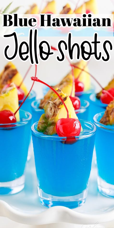 This simple recipe for blue Hawaiian jello shots combines Malibu rum with pineapple juice, blue Curacao, and berry gelatin topped with fun garnishes! Hawaiian Jello Shots, Raspberry Jello Shots, Alcohol Jello Shots, Blue Hawaiian Jello Shots, Rum Jello Shots, Blue Jello Shots, Peach Jello, Pineapple Jello, Jello Shots Recipe