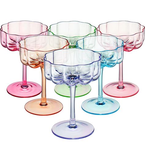 PRICES MAY VARY. Introducing the Bright Colored Flower Coupes, a set of six exquisite glassware pieces that combine elegance with a unique touch of color. Standing at 5.1 inches tall with a diameter of 3.9 inches, these coupes offer a capacity of 7 ounces, allowing you to enjoy your favorite martinis or cocktails in style. The standout feature of these glasses is their stunning bright colors and intrique design. Each glass is beautifully crafted and colored in pink, magenta blue, green, and oran Colorful Glassware Bar, Flower Shape Glasses, Prosecco Mimosa, Colorful Tablescapes, Champagne Martini, Colorful Cocktails, Cocktail Glassware, Champagne Cocktail, Flower Vintage