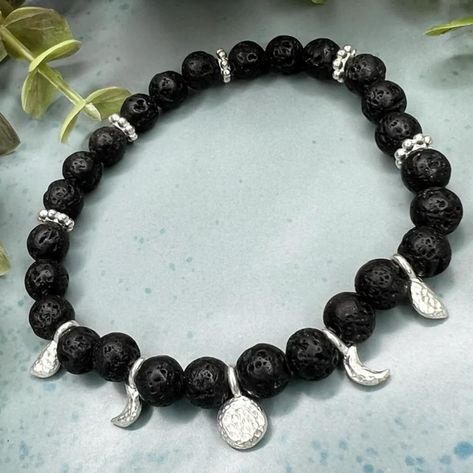 🌕✨ Celebrate the full moon with my stunning Diffuser Phases of the Moon Bracelet! 🌕✨ This beautiful bracelet is not only a stylish accessory but also a reminder of the ever-changing phases of the moon. Each little charm represents a different phase, from the waxing crescent to the full moon and beyond, allowing you to carry the lunar cycle with you wherever you go. 🌙✨ Made with quality Black Lava Beads & beautiful shiny Silver plated Phases of the Moon charms & spacers I use the best cord ... Moon Bracelet, Phases Of The Moon, Lunar Cycle, Diffuser Jewelry, Lava Beads, Boho Style Jewelry, The Full Moon, Lava Bead, Healing Jewelry