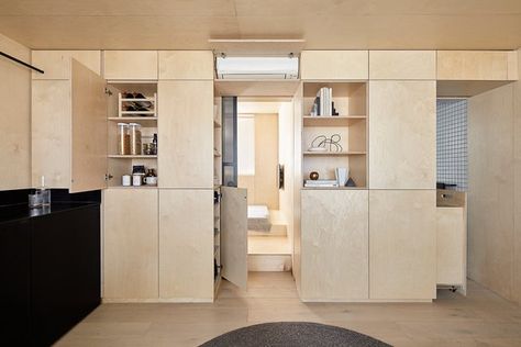 A "Micro Unit" Studio in Australia Is Packed With Plywood Storage | Hunker Garderobe Design, Plywood Storage, Laminate Cabinets, Micro Apartment, Casa Country, Studio Living, Apartment Renovation, White Laminate, Compact Living