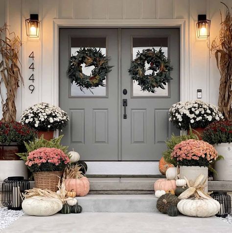 Floor Lanterns, Evergreen House, Pink Mums, Fall Front Door Decor, Fall Front Porch Ideas, White Siding, Farmhouse Front Porches, Grey Doors, Fall Front Porch Decor