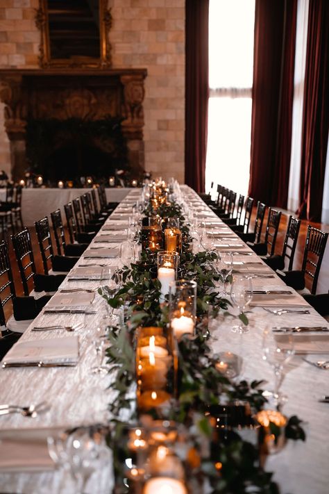 Wedding Greenery And Candles, Wedding Table Settings Long Tables, Greenery Reception Decor, Christmas Wedding In Florida, Dover Hall Estate Wedding, Black Chairs Wedding Reception, Winter Wedding Place Settings, Wedding Black Chairs, Black And Greenery Wedding