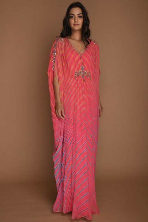 Featuring a pink kaftan tunic in georgette base with v-neck and embellishment. It is paired with a matching inner.  FIT: Fitted at bust. COMPOSITION: Georgette. CARE: Dry clean only. Rose Gold Bridesmaid Dress Long, Unique Kaftan Designs, Kaftan Dress Indian, Pink Kaftan, Kaftan Tunic, Embellished Fabric, Kaftan Designs, Long Kaftan, Salwar Kamiz