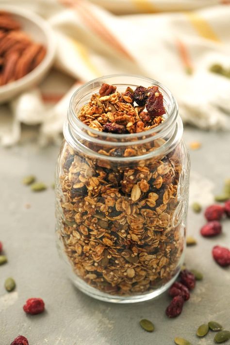 For a taste of fall, enjoy this healthy, homemade Pumpkin Granola recipe made with oats, quinoa, flax seed, maple syrup, pumpkin puree, pumpkin spice, cinnamon, pecans, pepitas, and dried cranberries. #granola #pumpkin #breakfast #oats #pumpkinspice #fallrecipes #healthyrecipes Skinnytaste Breakfast, Pumpkin Granola Recipe, Puree Pumpkin, Pumpkin Spice Granola, Pumpkin Granola, Breakfast Oats, Pumpkin Oats, Pumpkin Breakfast, Healthy Granola