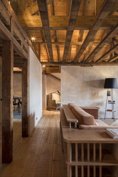 Adopting a less is more approach, CASCA stripped out 20th-century layers to reveal the original elements of the space, including its wooden frame, which has been restored and left exposed. Soaring ceiling trusses and beams cross every room, exaggerating the volume of the apartment. Photography: Architecture de Collection #architecture #design #interiors #lisbon #portugal #property Lisbon Apartment, Light Wooden Floor, Internal Courtyard, Wooden Ceilings, Renovation Design, Wooden Beams, Architectural Features, Stone Flooring, Residential Building