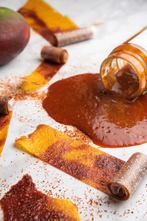 Mango Fruit Roll Ups with Chamoy and tajin are not only addicting, they are as FUN to make as they are to snack on. This is a fun recipe for the kids or the kid in you! | thefrayedapron.com #snackrecipes #mexicanfood #fruitrollups #funactivitiesforkids Mango Candy Recipe, Chamoy Fruit, Chamoy Mango, Mexican Fruit Cups, Chamoy And Tajin, Mango Chamoy, Mexican Party Food, Roll Ups Recipes, Mexican Snacks