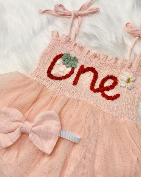 How cute is this 🍓💗🌼Berry 1st Birthday🌼💗🍓theme!! This “ONE” tutu romper is hand embroidered & perfect for her first birthday!! Comes in sizes 6-12m or 12-18m. Matching headband is included. #themodmango #themodmangobabyco #berry1stbirthday #berryfirstbirthday #strawberry1stbirthday #strawberryfirstbirthday #spring1stbirthday #summer1stbirthday #firstbirthday #firstbirthdayoutfit #berryfirstbirthday🍓 #babygirlfirstbirthdayoutfit #babygirlfirstbirthday #handembroidery #handembroidered Berry First Birthday Outfit Girl, Berry First Birthday Outfit, 1st Birthday Theme, Berry 1st Birthday, Baby First Birthday Themes, Her First Birthday, First Birthday Outfit Girl, Berry First Birthday, Strawberry Baby