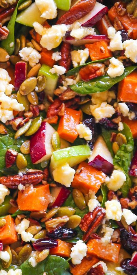 Fall Salad - Roasted Sweet Potato Salad with Spinach, Apples, Cranberries, Pecans, Pumpkin Seeds, Feta, and Maple-Lime Dressing - it's like Autumn on a plate. Perfect addition to your Fall and Winter menu. It's a healthy everyday salad that takes only 30 minutes to make and is meatless and gluten-free. You can also serve it as a festive side dish for any holiday dinner, especially for Thanksgiving and Christmas. Sweet Potato Snack, Everyday Salad, Roasted Sweet Potato Salad, Lime Salad Dressing, Sweet Potato Salad Recipe, Salad With Spinach, Potato Snack, Sweet Potato Sides, Autumn Salad Recipes