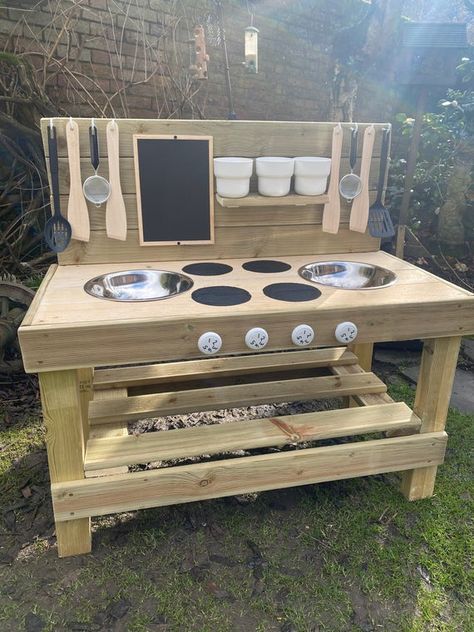 Children’s Mud Kitchen with DOUBLE sink, 8 utensils, chalk board, chalks, rubber. About: Bespoke mud kitchen, measurements; 100cm wide 60cm tall (to worktop) 85cm tall total (including back panel) 55cm deep (including turning knobs) However if you have specific size requirements the item can be Mud Table, Outdoor Play Kitchen, Mud Kitchen For Kids, Mud Kitchens, Diy Mud Kitchen, Kitchen Measurements, Play Garden, Outdoor Play Areas, Mud Kitchen