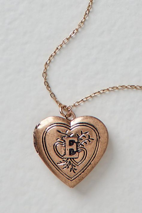 A super sweet gift or an accessory unique to you, this darling monogram necklace features a heart locket pendant with an initial engraving. **Features:** Dainty chain, heart locket pendant, hinge opening mechanism, monogram initial engraving, clasp closure **Why We | Monogram Necklace by Free People in Gold Unique Locket Necklace, Free People Necklace, Engraved Locket, Chain Heart, Couple Necklaces, Dainty Chain, Cool Gifts For Women, Classy Jewelry, Monogram Necklace