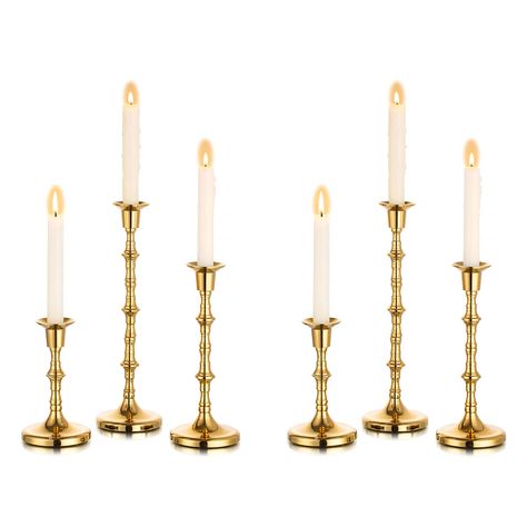 PRICES MAY VARY. 【Unique Design】The Nuptio long-handled taper candle holder features a vintage design. The flared opening prevents molten wax from dripping and damaging your furniture. These creative candlestick holders blend perfectly with any home decor.Perfect for fireplace, mantle, farmhouse, bathroom, dining room, kitchen, living room, bedroom, balcony, windows, etc. 【Upgrade Quality】The candle holders for candlesticks are made of high-grade metal, which is strong and stable. The candle bas Gold Taper Candle Holders, Gold Taper Candles, Glass Taper Candle Holders, Stemmed Candle Holders, Gold Candlestick Holders, Decorations For Living Room, Unity Candles, Tall Candlesticks, Green Tablecloth