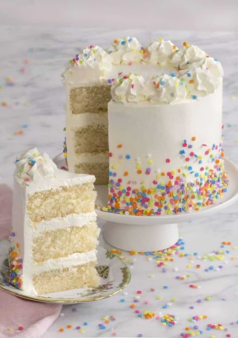 A moist vanilla cake filled with sprinkles, coated in silky Italian buttercream and topped with a white chocolate ganache. Say hello to your new favorite cake! Click over for full recipe and video. Drumstick Cake, Easy White Cake Recipe, Cake Recipe For Decorating, Homemade White Cakes, Moist Vanilla Cake, White Birthday Cakes, Unique Birthday Cakes, White Cake Recipe, Preppy Kitchen