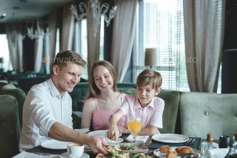 Happy family in a restaurant by AboutImages. Happy family with a child dining in a restaurant#restaurant, #family, #Happy, #dining Family At Restaurant Photography, Family Restaurant Photography, Hotel Breakfast Buffet, Sustained Investigation, Family Friendly Living Room, Hotel Ads, Restaurant Ad, Diy Background, Pacific Place