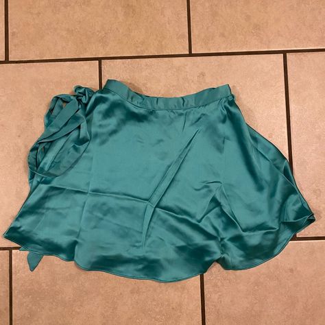 Flowy Teal Satin Skirt With Wrap Tie And Ruffle Hem. Feminine And Flirty Skirt Perfect For Summertime. Color Pops For Sure! New With Tags. Lululemon Tennis Skirt, Ripped Denim Skirts, Tennis Skirt Black, Camo Mini Skirt, Plaid Pleated Mini Skirt, Tiered Mini Skirt, Tan Skirt, Green Mini Skirt, White Mini Skirt