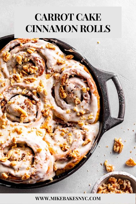 Carrot Cake Cinnamon Rolls with cream cheese icing and chopped walnuts on top nestled inside a cast iron skillet. Carrot Cake Cinnamon Buns, Carrot Cake Cinnamon Rolls, Cake Cinnamon Rolls, Cinnamon Carrots, Brioche Dough, Cake Cinnamon, Cinnamon Roll Recipe, Carrot Spice Cake, Purple Carrot