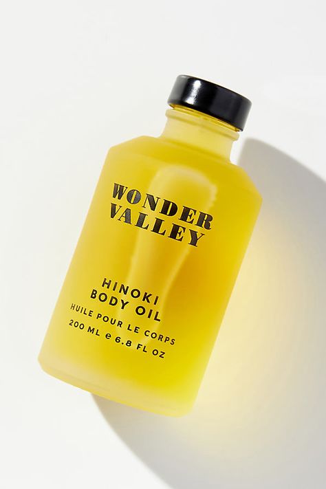 With an intoxicating scent of rare Siberian fir and Japanese hinoki, this luxurious skin-softening body oil imparts a remarkable radiance and works to penetrate deep to hydrate, promote elasticity, and fortify the integrity of the skin’s natural barrier. | Hinoki Body Oil by Wonder Valley at Anthropologie Body Oil Packaging, Wonder Valley, Wellness Home, Siberian Fir, Must Have Products, Natural Skin Care Ingredients, Skincare Products Photography, Facial Skin Care Routine, Oil Skin Care