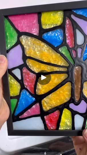 Easy Stained Glass Tutorial | Here's a step by step tutorial on how to turn Dollar Tree picture frames into faux stained glass 😍 

This is a great project for spring/Easter that kids... | By Emily Seilhamer Art | Let me show you how to turn
Dollar Tree picture frames into stained glass art. All you need
is a picture frame. I'm going to use two different sizes
today and some simple patterns. I sketched out a cross and a
butterfly but you could print off simple coloring book pages
or there's even free stained glass art images that you can
download and print as well. So, decide what pattern you're
going to use and then you're going to put it in the frame
pattern side down against the glass just like you were
framing it yourself. I like to tape my image on one side just
to make sure it doesn' Faux Stained Glass Diy How To Make, How To Make Stained Glass Art, Painting On Glass Frame, Stained Glass Picture Frames, Butterfly Glass Painting, Stained Glass Patterns Free Printables Templates, Faux Stained Glass Diy, Easy Glass Painting, Dollar Tree Picture Frames