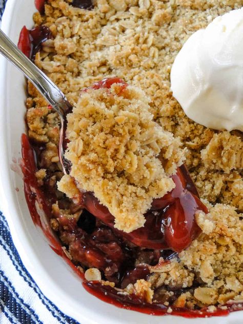 This Cherry Crisp Recipe is a quick and easy dessert made with pie filling and a crunchy oat topping. Top it with a scoop of ice cream or whipped cream and it's heavenly! Cherry Crisp With Pie Filling, Cherry Crisp Recipe, Cherry Crisp, Cherry Crumble, Blueberry Crisp, Scoop Of Ice Cream, Cherry Filling, Instant Oatmeal, Crisp Recipe