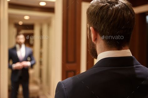 Man looking in mirror wearing suit by vadymvdrobot. Close up shot of back of bearded man wearing suit and looking at himself in mirror in wood dressing room#suit, #vadymvdrobot, #Close, #Man People Working Together, Meet Guys, People Person, Male Man, Business People, Black Business, Bearded Men, Teamwork, Business Man