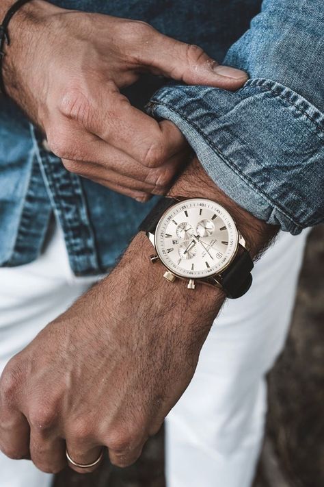 Thanks @about.marvin for this awesome photo! This is a gorgeous timepiece, designed by Dane Dapper in Denmark with careful attention to the details. If you look closely, you’ll see concentric circles and a grid pattern on the white dial. Framed by gold-toned bezel and lugs, the black leather strap, easily interchangeable, lends it a nice, stylish contrast. #trendhim #menstyle #menswatch #danedapper #urbanstyle #gentlemanstyle #watch #guyswatch Mens Watch Photography, Watch Photoshoot, Watch Painting, Lifestyle Jewelry, Natural Man, Concentric Circles, Man Photography, Watch Photo, Mens Workwear