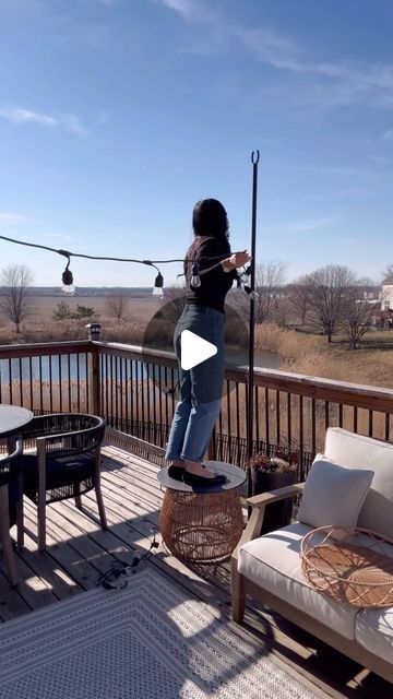 Amanda Albrecht Illinois Realtor + Content Creator on Instagram: "The easiest way to hang string lights in your outdoor space. These open ended light poles are adjustable in length, and can be added to a planter or screw down to your decking.   They can also be used in grass they come with stakes. I usually use three strands of lights to create a triangle over our outdoor seating.   Simply feed the light strand through the open, ended pole and using a no hole vinyl hook attached to the home these hooks are awesome. They just slide in and easily come out when you’re done leaving no damage.   we are officially ready for patio season, and the warm weather that comes with it. . . . #outdoorliving #outdoorspace #spring #stringlights #outdoorproject #home #outdoorfurniture #homedesign #spring #p Deck Lights Ideas Hanging, String Light Poles Patio, How To Hang Outdoor String Lights, String Lights On Deck, Outdoor String Lighting Ideas, Patio Lights String Ideas, Deck String Lights, Realtor Content, Patio String Lights