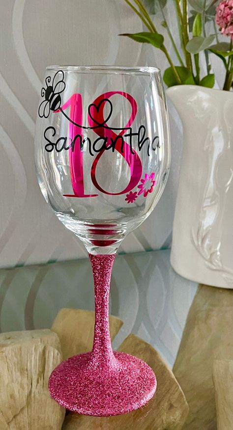 Add that little extra sparkle to any celebration with our beautiful personalised  glasses. This particular Glass can be personalised with the the name of a loved one with your age of choice. The stems and bases of the glasses are fully glittered the same colour as the age on the glass. The perfect gift for someone special. A wide range of colours are available. Your name will be written in black across the age (unless you request otherwise), which will be in the colour of your choice. The beauti 21st Birthday Glass, Bumble Bee Birthday, Diy Gifts To Sell, 21st Bday Ideas, Wine Glass Designs, Personalized Glassware, Birthday Glitter, Birthday Wine Glass, Idee Cricut