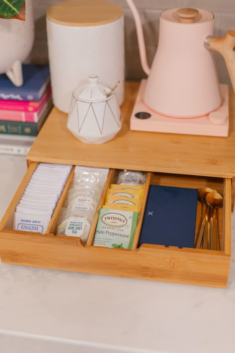 Move over coffee, the tea drinkers are getting serious! If you love a good cuppa, here's everything you'll need to create a cozy tea station at home. Everything from a tea drawer, to great tea spoons, to the perfect way to hide the cord from your electric kettle. Tea Station At Home, Office Ideas Interior Design, Tea Drawer, Office Coffee Station, Modern Home Office Ideas, Tea Room Decor, Bar Nook, Wallpaper Off White, Off White Kitchens