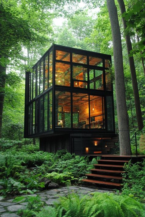 Prefab tiny glass cube house in a lush forest. Check out all of these innovative and stylish prefab homes that bring modern designs to life. This is the future of cheap and sustainable living! Prefabricated Tiny House, Modern A Frame Tiny House, Cube Homes Tiny House, Tiny House With Lots Of Windows, Prefab Modern Cabin, Glass Tiny House Woods, Tiny Home Prefab, Glass Cube Architecture, Tiny Prefab Homes