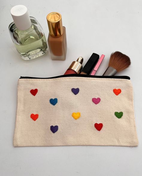 Hand embroidered cololurful heart canvas pouch with zip. Hand embroidered hearts makeup bag, toiletry bag. Embroidered canvas pencil case. Diy Toiletry Bag, Embroidered Totes, Hearts Makeup, Diy Toiletries, Stitches Makeup, Fashion Studies, Cute Pencil Pouches, Embroidered Pouch, Embroidered Hearts