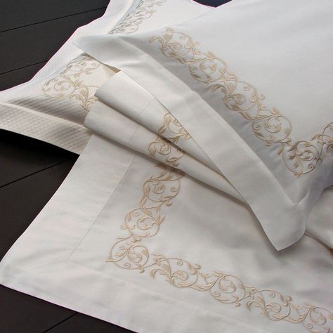 Dea's Ramages bedding collection is made from a 700 thread count cotton sateen for a smooth touch and features an elegant beige embroidered Florentine Scroll throughout collection. Available color combination is Ivory sheeting with Beige embroidery. This collection is custom made to order and requires a 4-6 week lead time. Made in Italy. Standard and King Shams come with embroidery on 3 sides. Boudoir and Euro Shams come with embroidery on 4 sides. Pillow Shams and Duvet Cover comes with a U-Sha Embroidery Bedding, Beige Duvet Covers, Beige Embroidery, Saree Kuchu Designs, Peacock Alley, Embroidered Bedding, Yves Delorme, Baby Gender Reveal Party, Luxury Bedding Collections