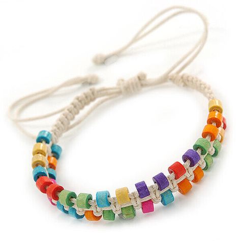 Multicoloured Wood Bead Friendship Bracelet With White Cord - Adjustable Features a plaited white cotton cord design accented with small multicoloured wooden beads. Treat a loved one to something special with this fashion-forward friendship bracelet. This woven bracelet secures with an adjustable Chinese knot so it should fit most wrist sizes. Add a pop of colour to your everyday jewellery look with this simple woven bracelet. The bracelet is about 10mm in width. Murzana offers a great selection of fashion and costume jewellery: affordable everyday necklaces, chokers, bracelets, bangles, armlets, rings, earrings, brooches, hair jewellery and other accessories. We invite you to check our whole range and decide on your favourite items by adding the them to your wish list or straight to your Bead Friendship Bracelet, Everyday Necklaces, Bracelet Cord, Everyday Jewellery, Holiday Crafts Diy, Friendship Bracelets With Beads, Hair Jewellery, Woven Bracelet, Chinese Knot