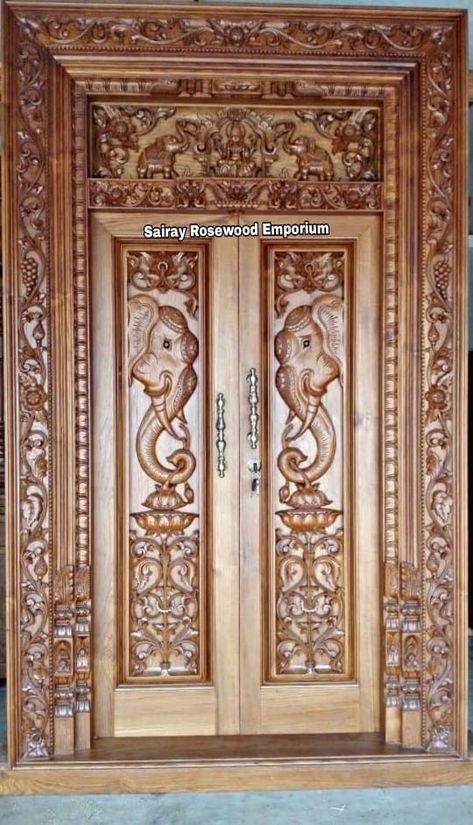 Pooja Room Door Carving Designs, House Main Door Design Woods, Double Door Carving Design Wood, Wooden Double Door Design Entrance Carved Wood, Wood Carving Doors Design, Main Door Carving Design Double Door, Carved Doors Wooden, Take Wood Main Door Design, Pooja Room Door Design Wood Carving