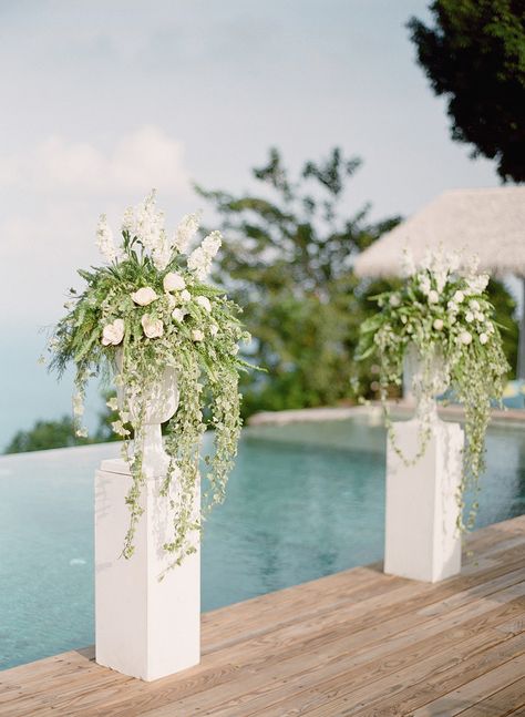 Read More: https://www.stylemepretty.com/2018/02/13/tropical-greenery-wedding-inspiration/ Wedding Standing Flower, Wedding Alter Flower Pillars, Flower Pillars Wedding, Wedding Alter Flowers, Flower Stand Wedding, Wedding Columns, Alter Flowers, Wedding Pillars, Standing Flower