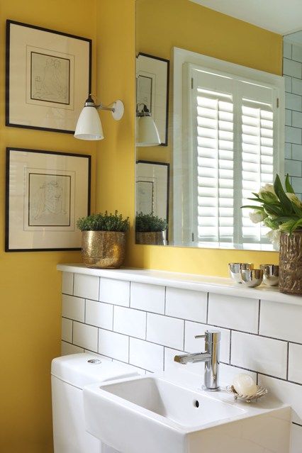 Bright yellow paint works as a perfect foil to white industrial tiles and gold accessories in this London bathroom. Bad Inspiration, Bathroom Paint Colors, Yellow Bathrooms, Bathroom Color, Downstairs Bathroom, Boho Bathroom, Yellow Walls, Small Bathroom Design, Intelligent Design