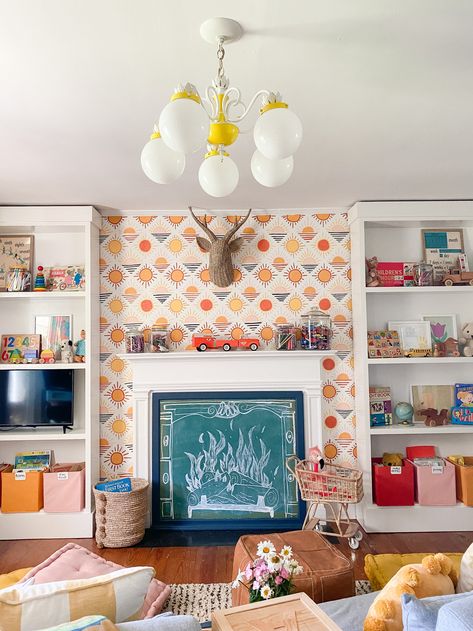 Bright, Colorful, Vintage Playroom Makeover  |  Gathered Living  |  Fireplace Playroom with Built-in Shelves Storage Fireplace Playroom, Funky Fireplace, Cozy Playroom, Playroom Fireplace, Basement Kids, Vintage Playroom, Fireplace Cozy, Playroom Makeover, Boy Rooms