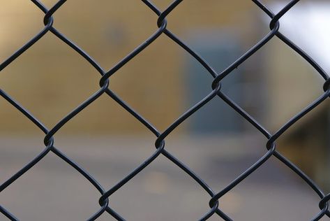 Chain link fences are typically silver-colored galvanized steel. Although the galvanized links and posts are rust resistant, they can deteriorate to the point where you need to refinish the fence. It’s not a difficult task. Don’t be tempted to spray paint the fence, because you will lose a lot of ... How To Paint A Chain Link Fence, Painted Metal Fence, Spray Paint Chain Link Fence, Painting Chain Link Fence, Paint Chain Link Fence, Paint A Chain Link Fence, Chain Link Fence Makeover, Painted Chain Link Fence, Chain Link Fence Ideas