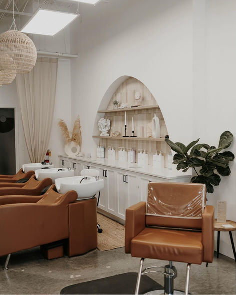 In a Bohemian, Coastal fused interior designed salon space stands caramel-colored shampoo systems. Scandinavian Hair Salon Interior Design, Costal Hair Salon, Coastal Salon, Beachy Salon, Salon Esthetics, Color Bar Salon Ideas, Boho Salon Ideas, Hair Salon Bathroom, Modern Hair Salon Interior Design